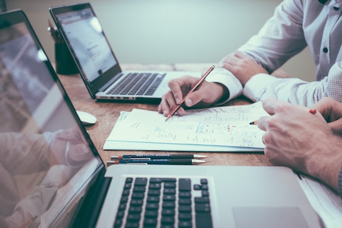 two people reviewing business loan proposal