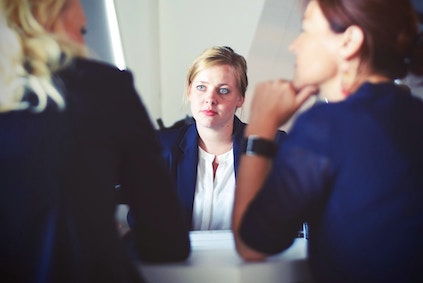 three women discussing business loans