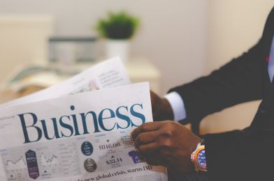 business finance man reading business newspaper 