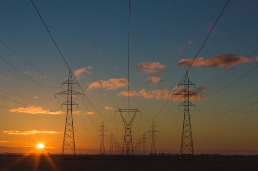 electricity pylons in field