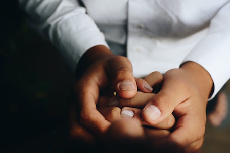 Doctor holding a patients hands